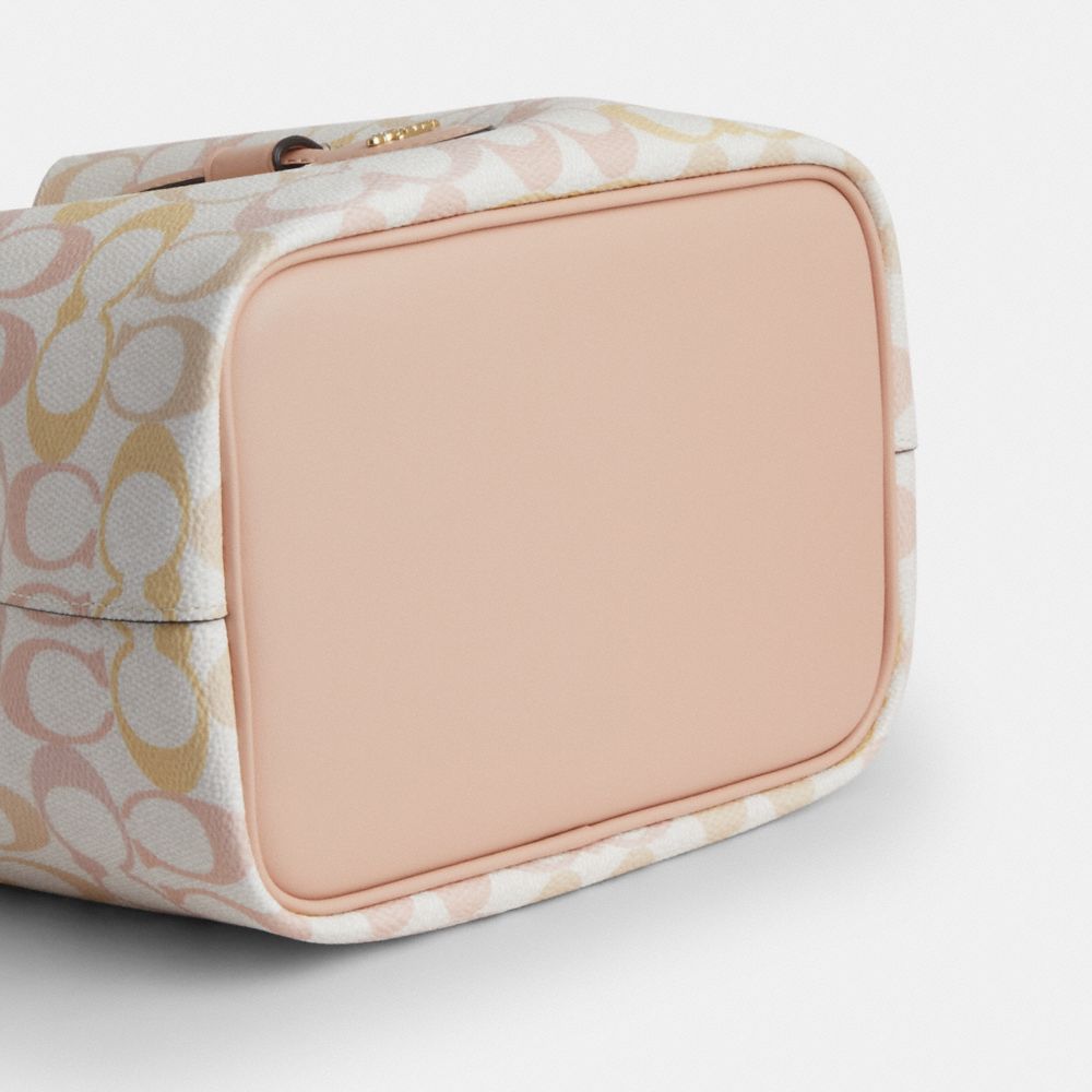 ROWAN BUCKET BAG IN PRETTY SIGNATURE CANVAS
