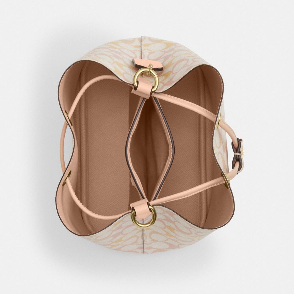ROWAN BUCKET BAG IN PRETTY SIGNATURE CANVAS