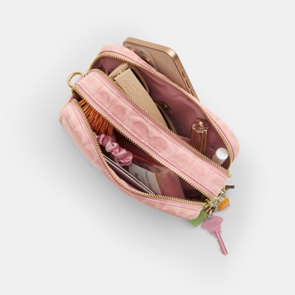 MINI CAREY CROSSBODY BAG IN SIGNATURE DENIM