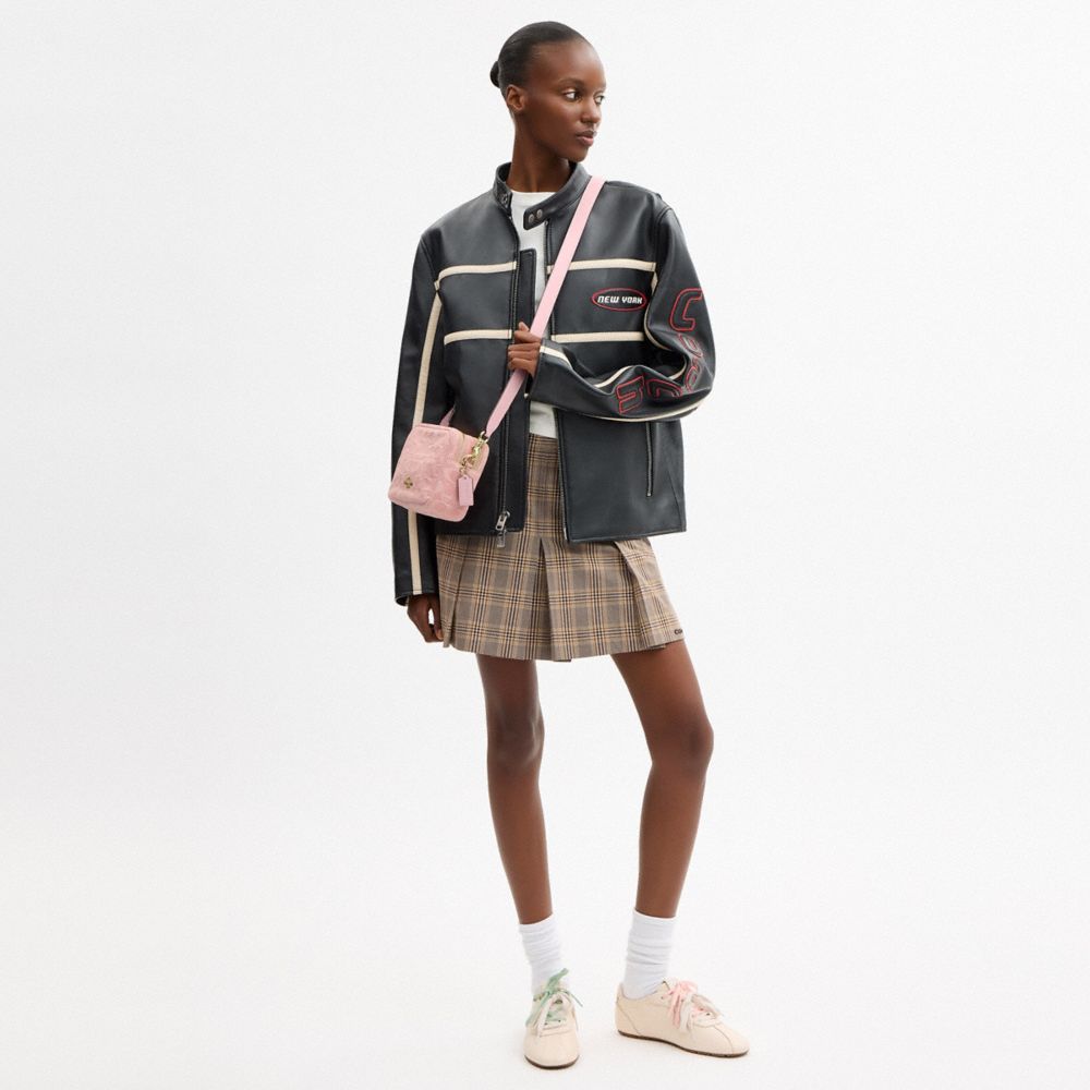MINI CAREY CROSSBODY BAG IN SIGNATURE DENIM