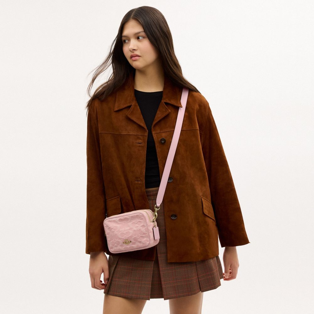 MINI CAREY CROSSBODY BAG IN SIGNATURE DENIM