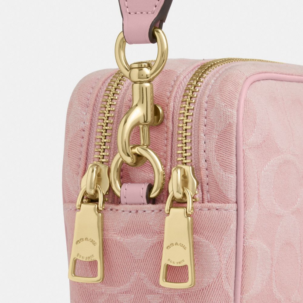 MINI CAREY CROSSBODY BAG IN SIGNATURE DENIM