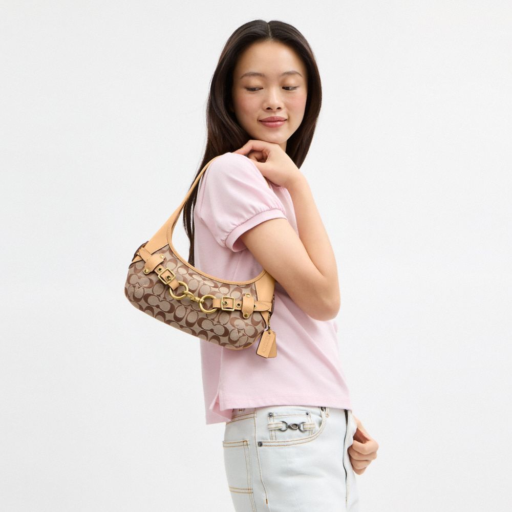 BELTED ERGO SHOULDER BAG 26 IN SIGNATURE JACQUARD