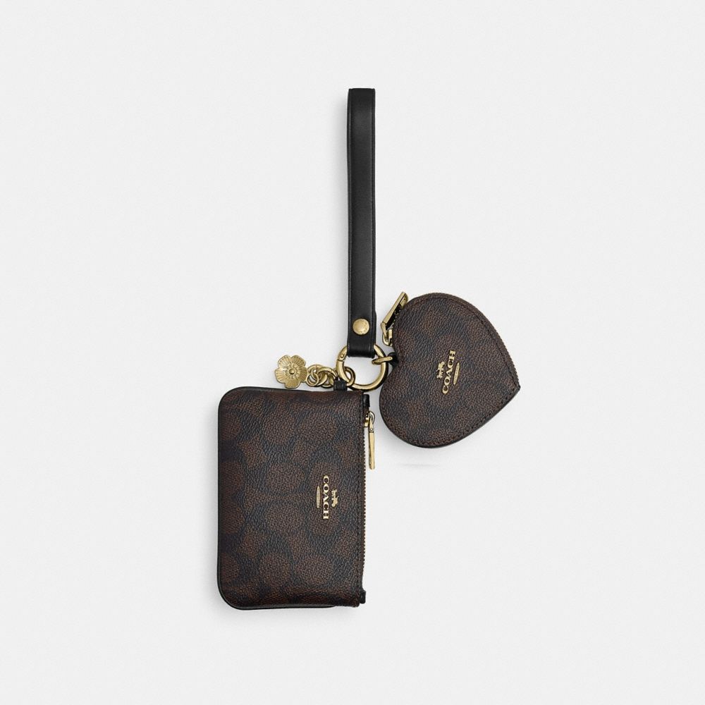 WRISTLET AND HEART POUCH IN SIGNATURE CANVAS WITH CHARM