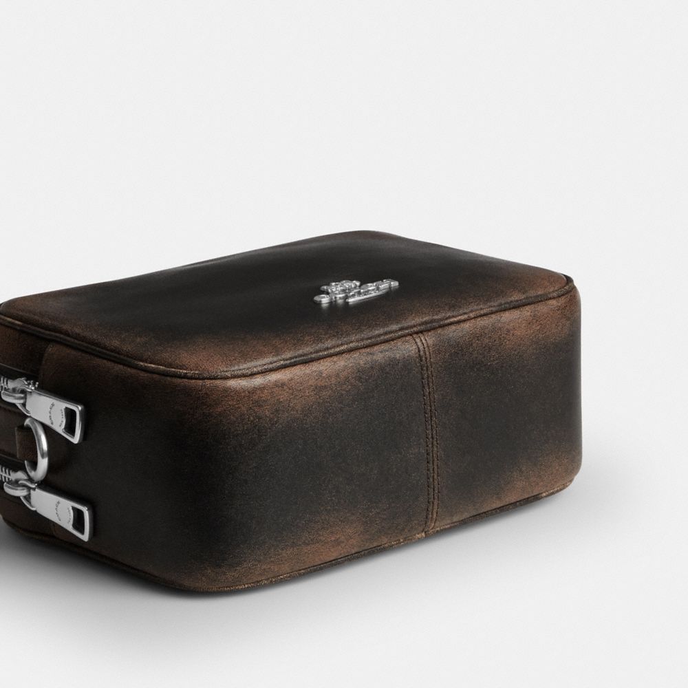MINI CAREY CROSSBODY BAG IN LOVED LEATHER