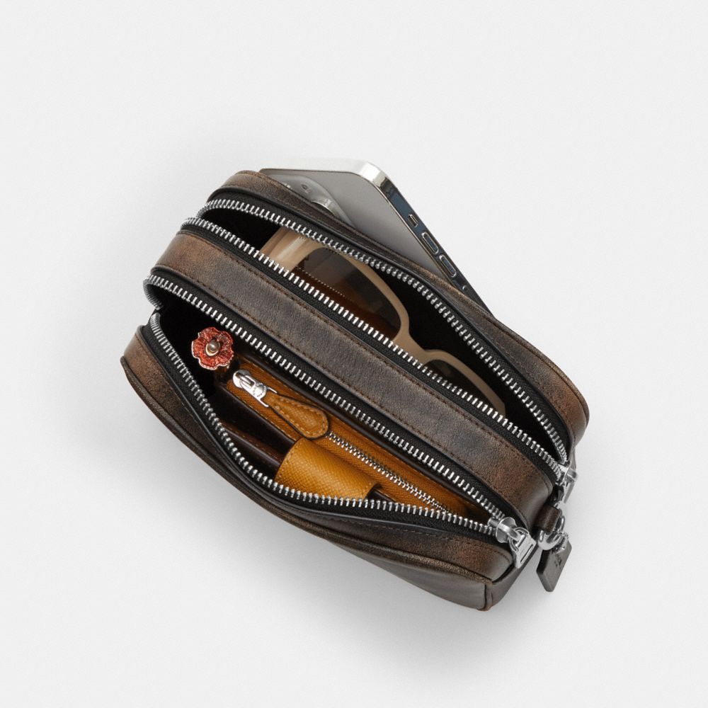 MINI CAREY CROSSBODY BAG IN LOVED LEATHER