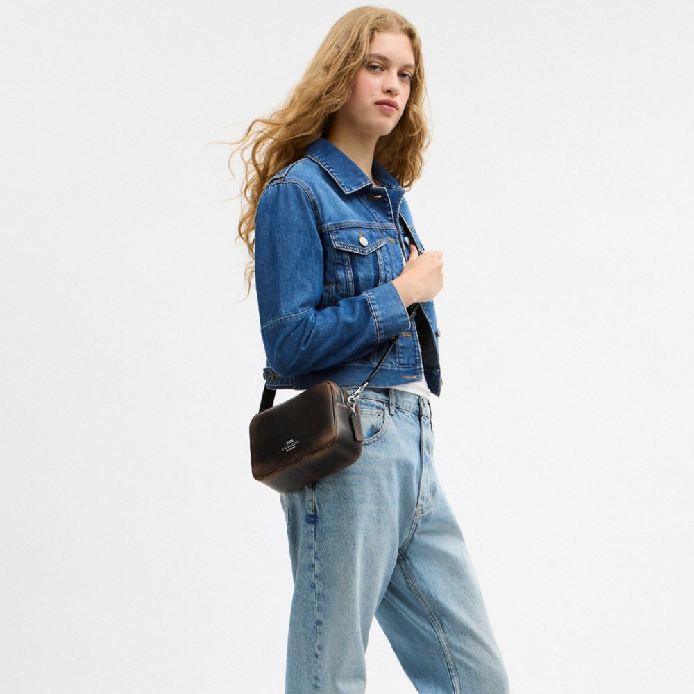 MINI CAREY CROSSBODY BAG IN LOVED LEATHER