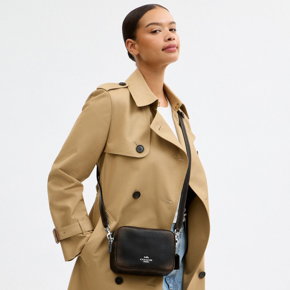 MINI CAREY CROSSBODY BAG IN LOVED LEATHER
