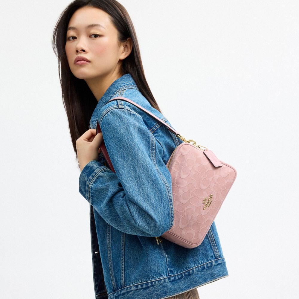 CAREY CROSSBODY BAG IN SIGNATURE DENIM