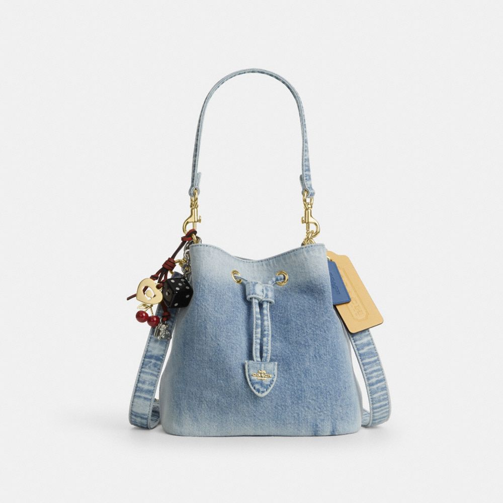 ROWAN BUCKET BAG IN LOVED DENIM WITH CHARMS