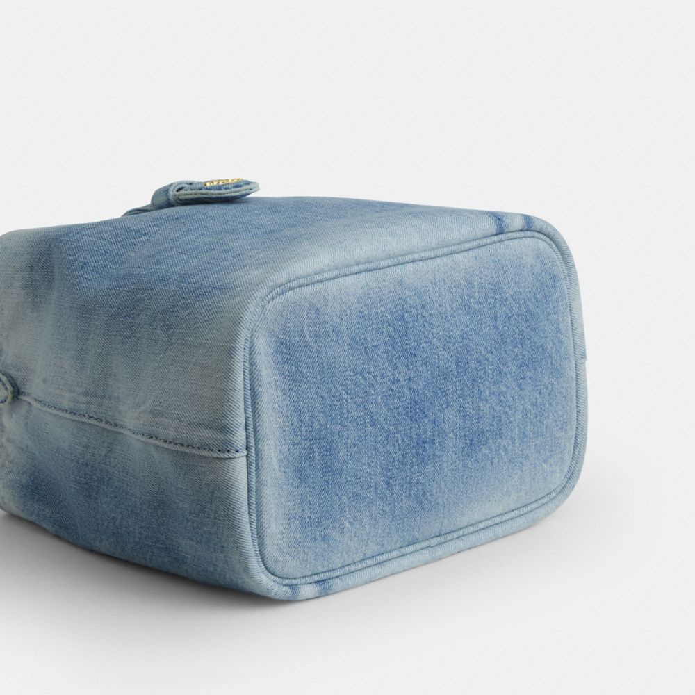 ROWAN BUCKET BAG IN LOVED DENIM WITH CHARMS