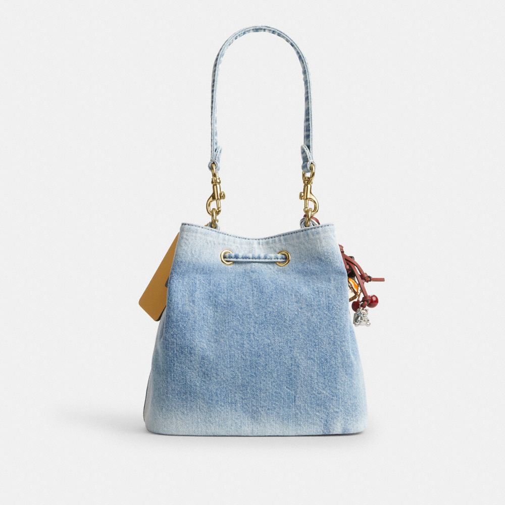 ROWAN BUCKET BAG IN LOVED DENIM WITH CHARMS