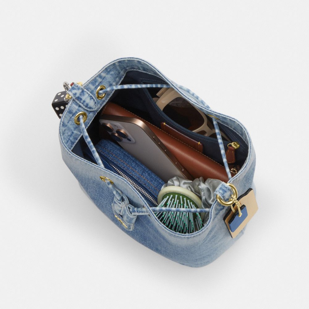 ROWAN BUCKET BAG IN LOVED DENIM WITH CHARMS