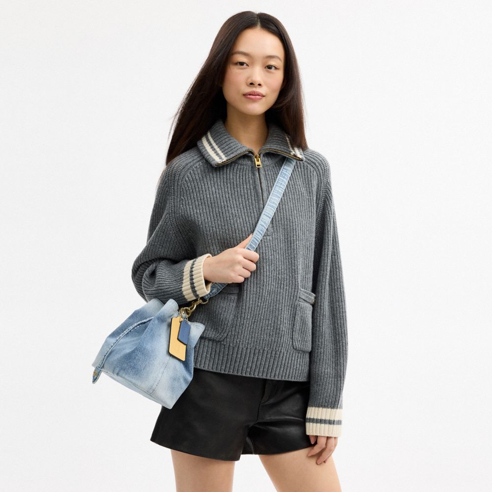 ROWAN BUCKET BAG IN LOVED DENIM WITH CHARMS