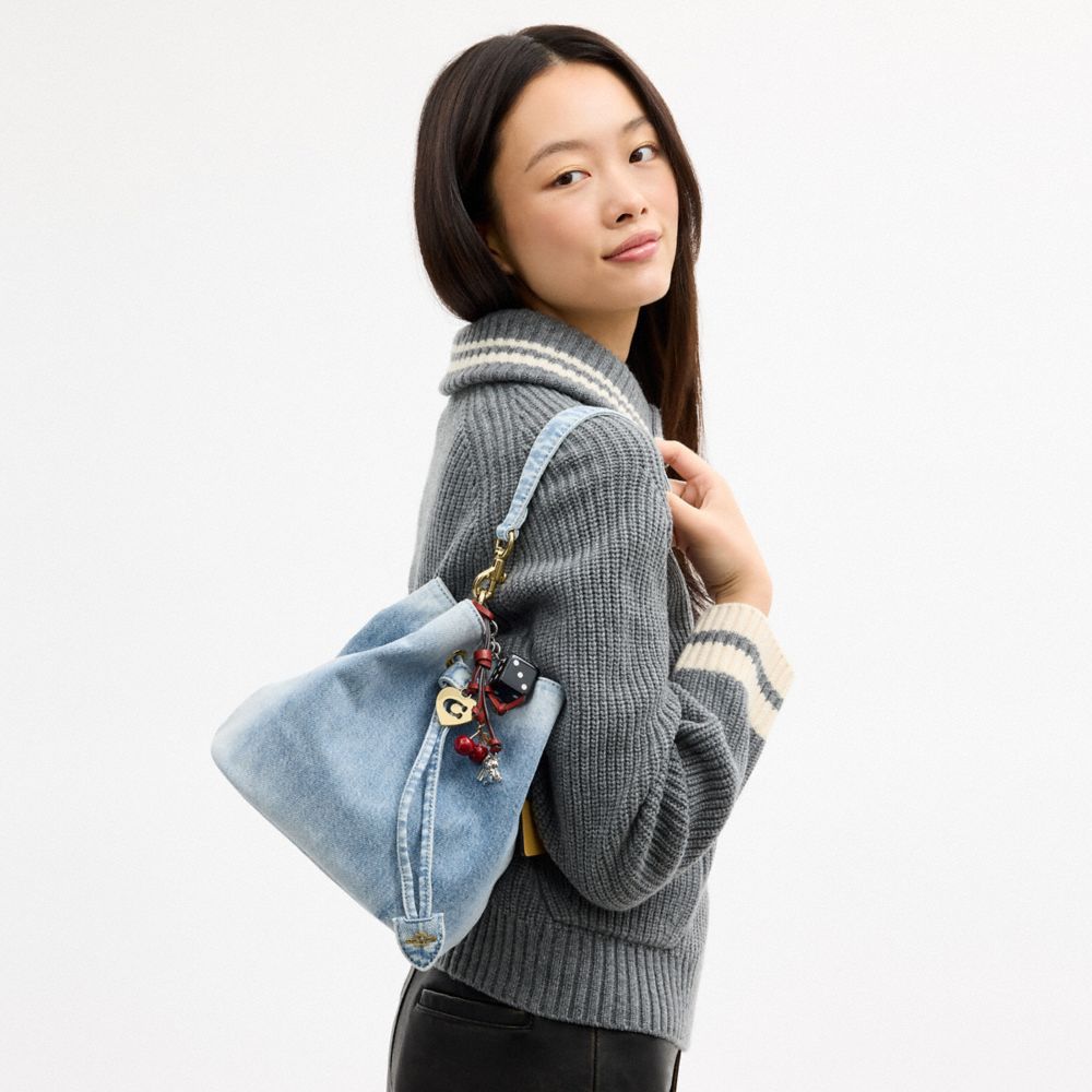 ROWAN BUCKET BAG IN LOVED DENIM WITH CHARMS