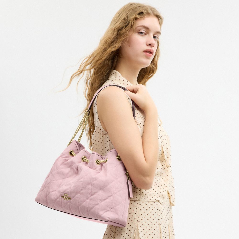 EVELYN SHOULDER BAG IN LOVED DENIM WITH QUILTING AND CHARM