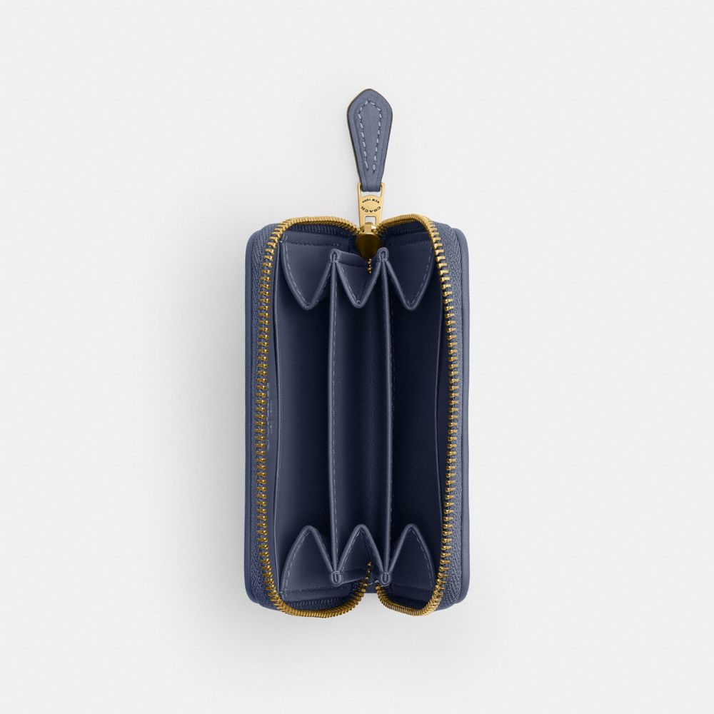 ESSENTIAL SMALL ZIP AROUND CARD CASE IN REGENERATIVE COTTON DENIM WITH CRYSTAL SIGNATURE