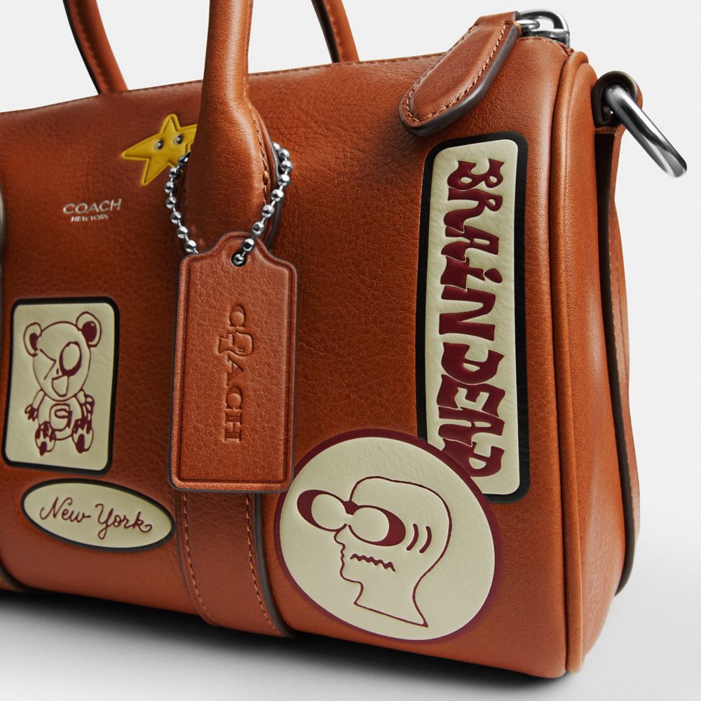 COACH | BRAIN DEAD COMPASS BAG 25 WITH PATCHES