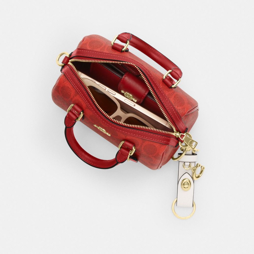 MINI ROWAN CROSSBODY BAG IN SIGNATURE CANVAS