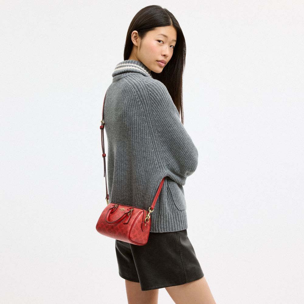 MINI ROWAN CROSSBODY BAG IN SIGNATURE CANVAS