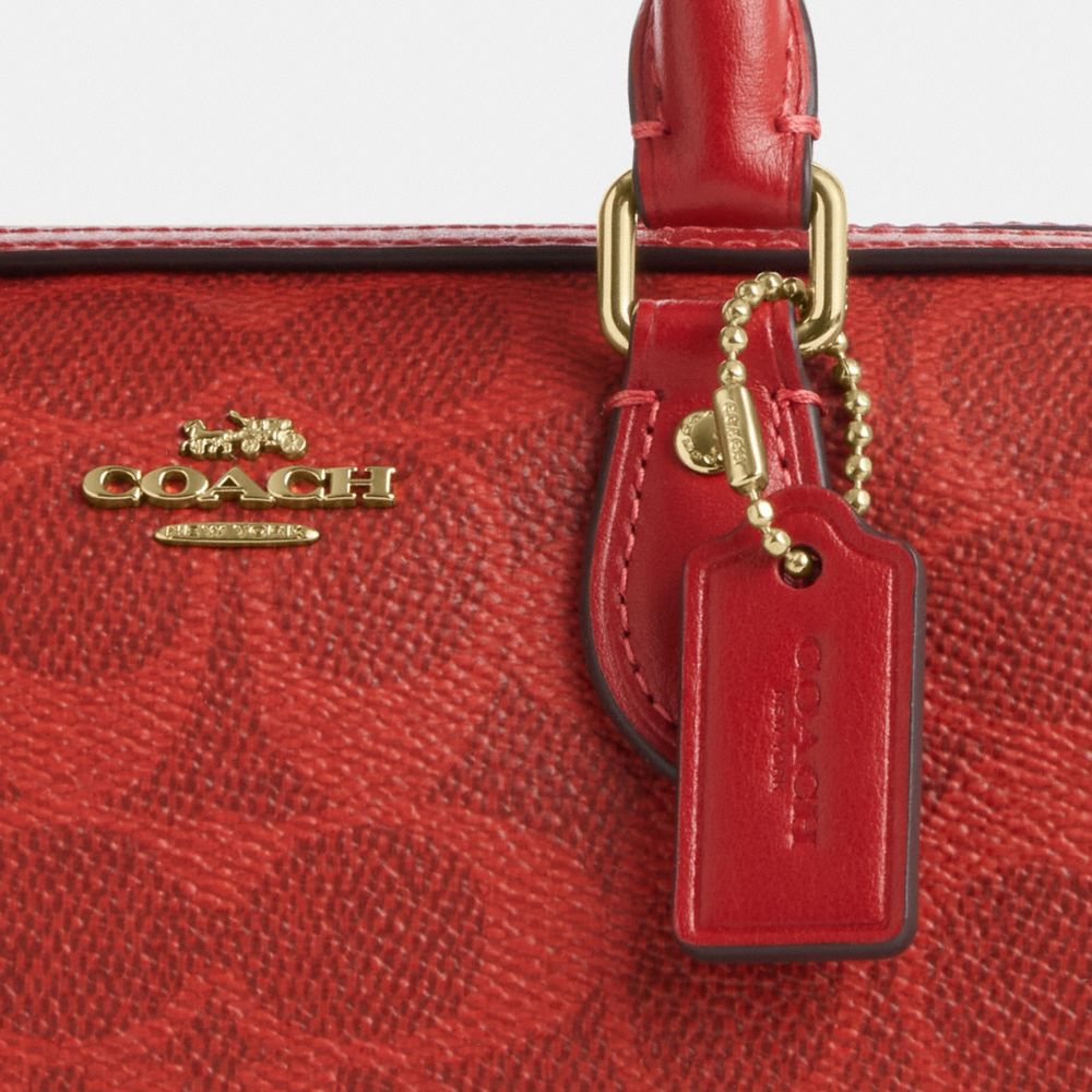 MINI ROWAN CROSSBODY BAG IN SIGNATURE CANVAS