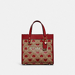 COACH CF127 Field Tote 22 In Signature Canvas With Heart Print BRASS/TAN RED APPLE