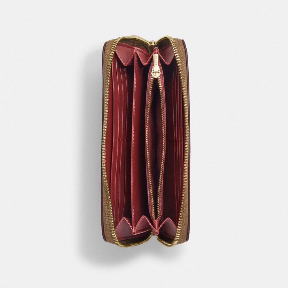 COACH X PEANUTS LONG ZIP AROUND WALLET IN SIGNATURE CANVAS WITH PATCHES