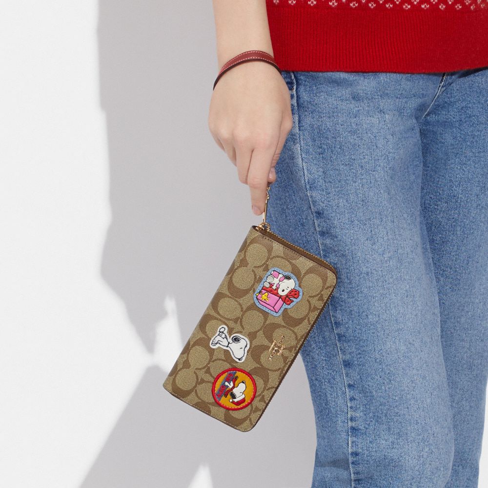 COACH X PEANUTS LONG ZIP AROUND WALLET IN SIGNATURE CANVAS WITH PATCHES