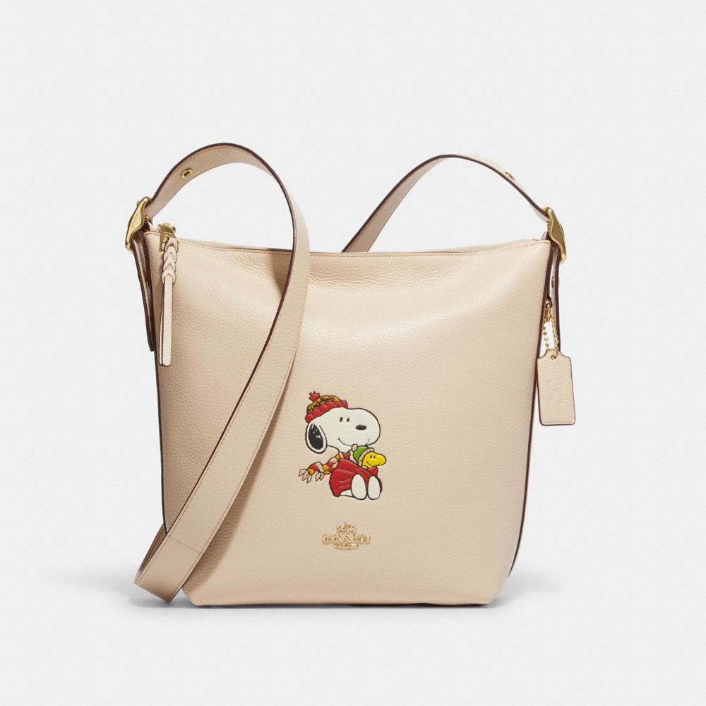 COACH CF292 Coach X Peanuts Val Duffle With Snoopy Cuddle Motif Gold/Ivory Multi