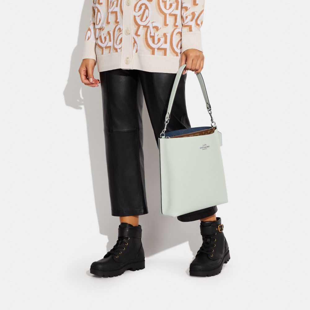 MOLLIE BUCKET BAG WITH SIGNATURE CANVAS INTERIOR