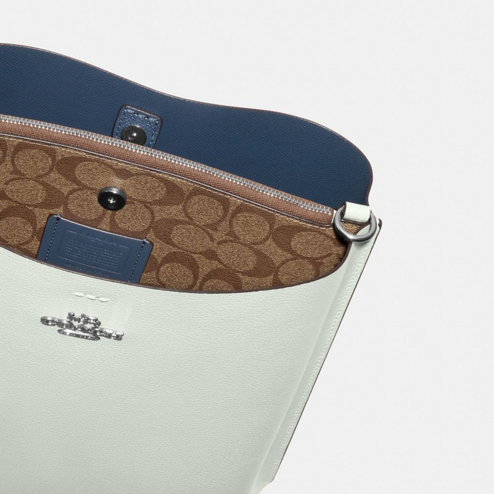 MOLLIE BUCKET BAG WITH SIGNATURE CANVAS INTERIOR