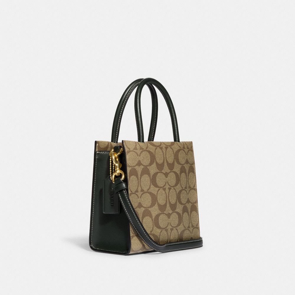 MINI CALLY CROSSBODY IN SIGNATURE CANVAS WITH VARSITY MOTIF