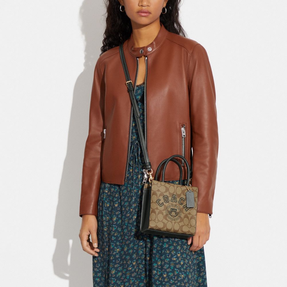 MINI CALLY CROSSBODY IN SIGNATURE CANVAS WITH VARSITY MOTIF