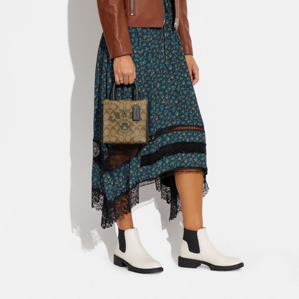 MINI CALLY CROSSBODY IN SIGNATURE CANVAS WITH VARSITY MOTIF