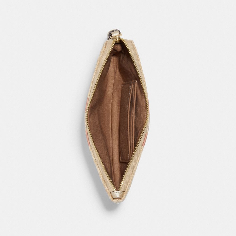 DEMPSEY LARGE CORNER ZIP WRISTLET IN SIGNATURE JACQUARD WITH STRIPE AND COACH PATCH