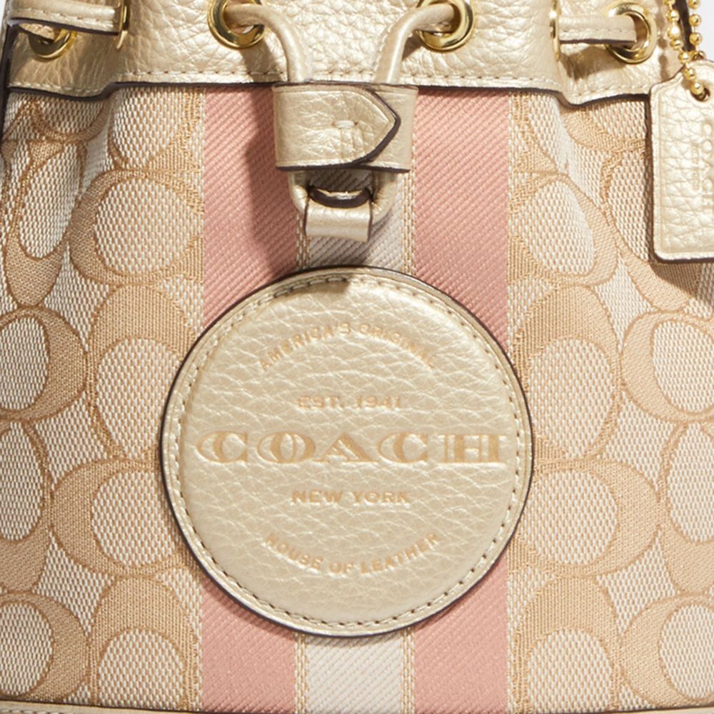 MINI DEMPSEY BUCKET BAG IN SIGNATURE JACQUARD WITH STRIPE AND COACH PATCH