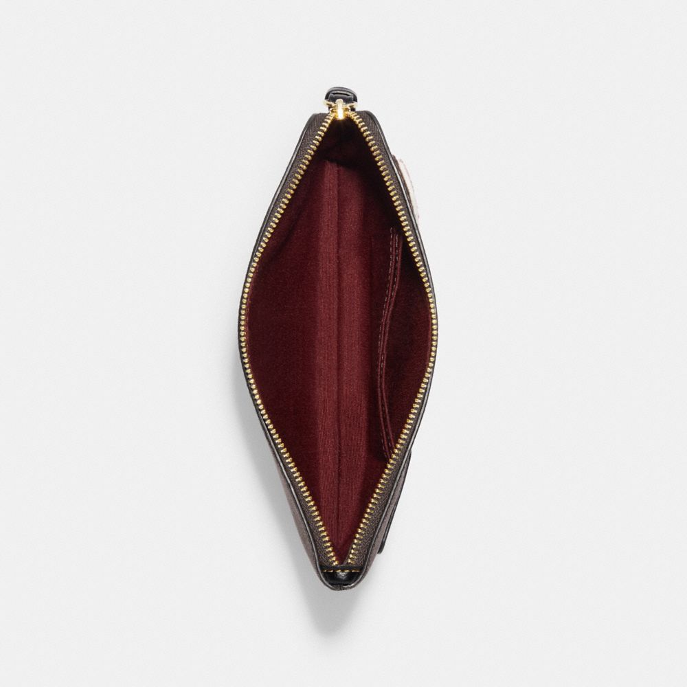 LARGE CORNER ZIP WRISTLET IN SIGNATURE CANVAS WITH SKI PATCHES