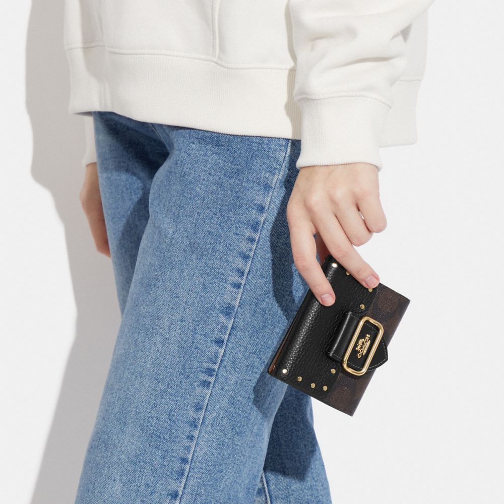 SMALL MORGAN WALLET IN COLORBLOCK SIGNATURE CANVAS WITH RIVETS