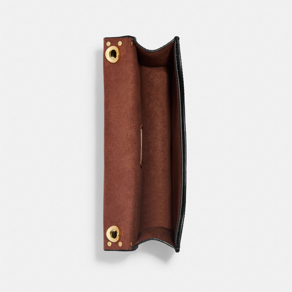 MORGAN CROSSBODY IN COLORBLOCK SIGNATURE CANVAS WITH RIVETS