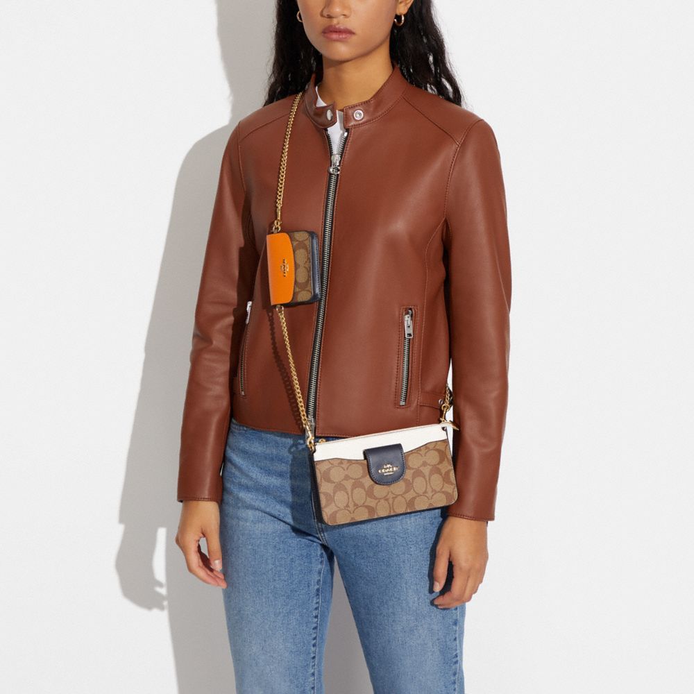 POPPY CROSSBODY IN COLORBLOCK SIGNATURE CANVAS