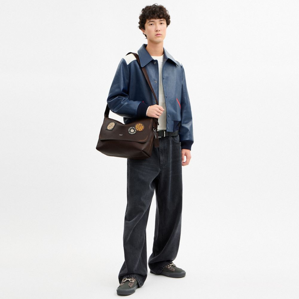 LUDLOW MESSENGER BAG IN LOVED LEATHER WITH STICKERS
