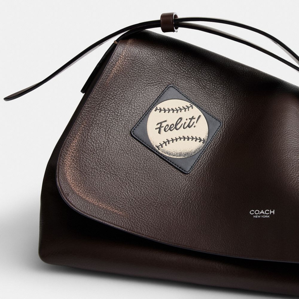 LUDLOW MESSENGER BAG IN LOVED LEATHER WITH STICKERS