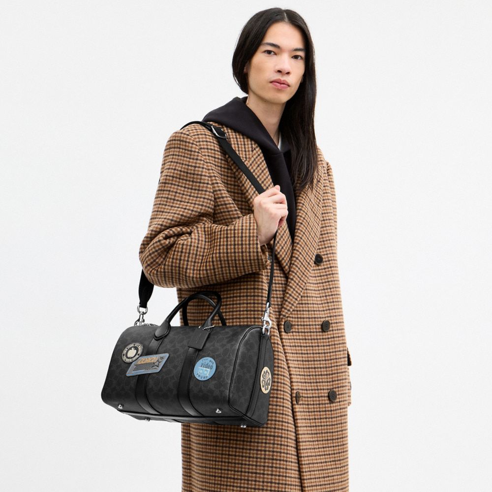 COMPASS BAG 35 WITH STICKERS IN SIGNATURE UPCRAFTEDLEATHER