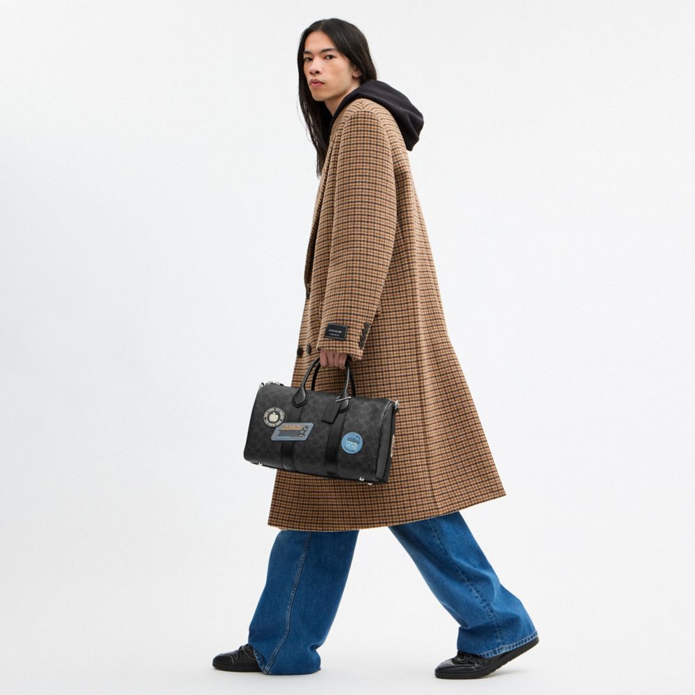 COMPASS BAG 35 WITH STICKERS IN SIGNATURE UPCRAFTEDLEATHER