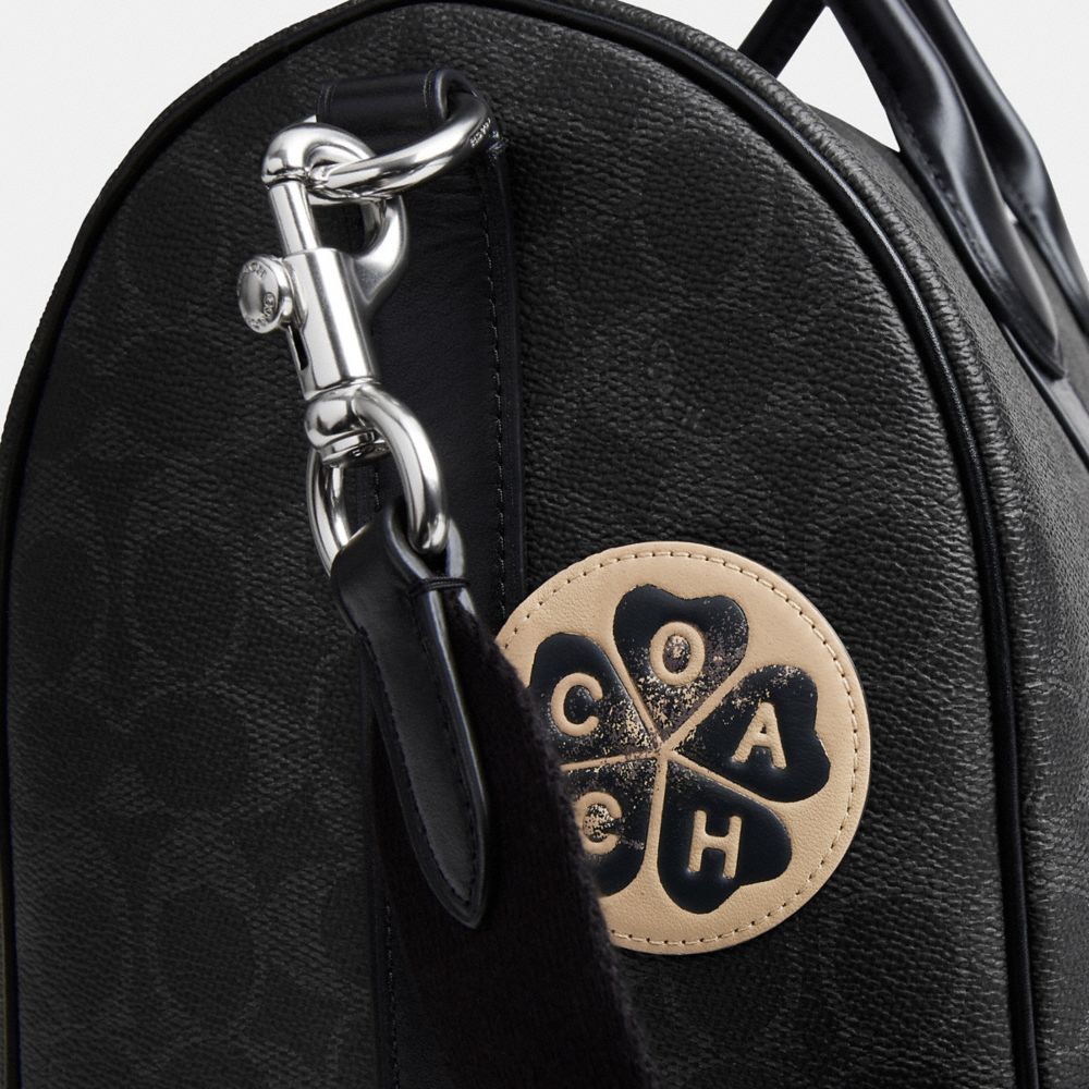 COMPASS BAG 35 WITH STICKERS IN SIGNATURE UPCRAFTEDLEATHER