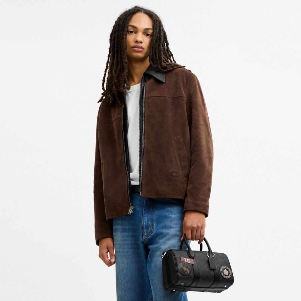 COMPASS BAG 25 WITH STICKERS IN SIGNATURE UPCRAFTEDLEATHER