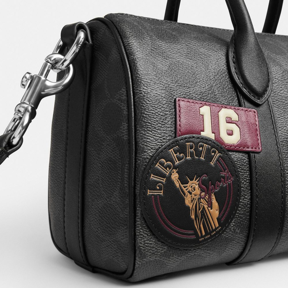 COMPASS BAG 25 WITH STICKERS IN SIGNATURE UPCRAFTEDLEATHER