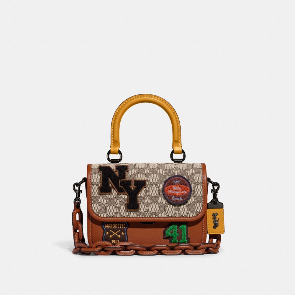 COACH CG217 Rogue Top Handle In Signature Textile Jacquard With Varsity Patches Pewter/Mustard Burnished Amber