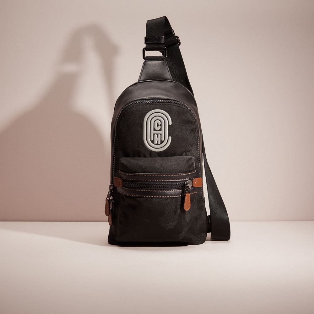 CG703 - Restored Academy Pack With Camo Print And Reflective Coach Patch Black Copper/Black Wild Beast