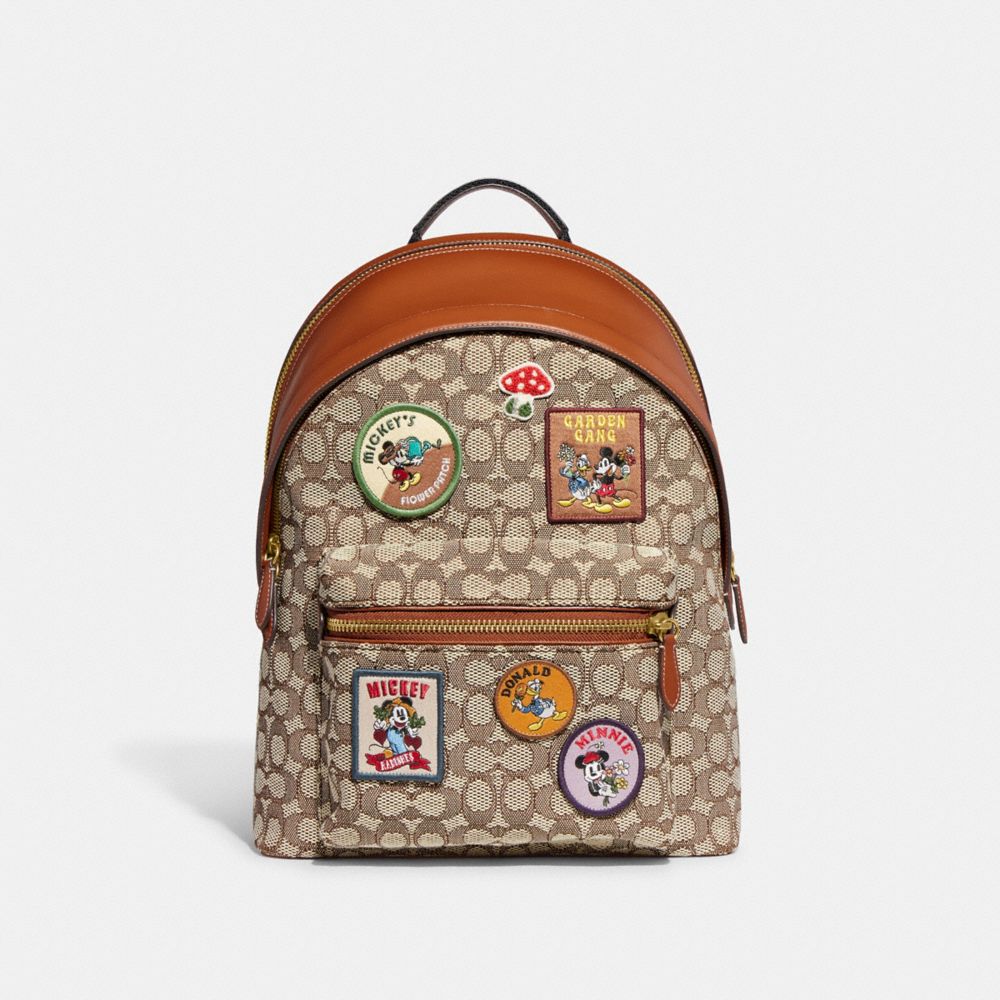 COACH CG975 Disney X Coach Charter Backpack In Signature Textile Jacquard With Patches Cocoa Multi